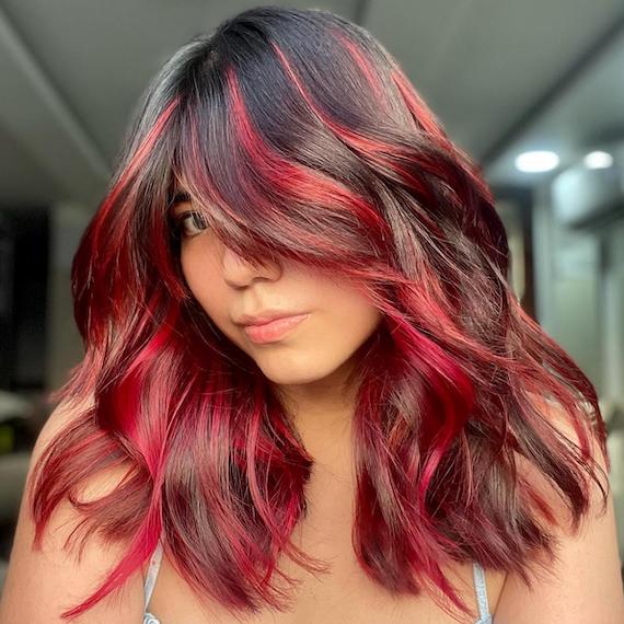 Are Black and Red Highlights Hairstyles Right for You? Discover how this hairstyle can enhance your features and match your style.