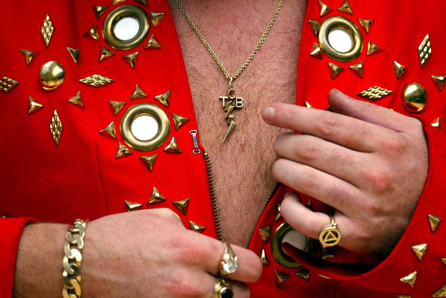 Elvis TCB necklace meaning, why did Elvis Presley wear it, and what does TCB stand for?